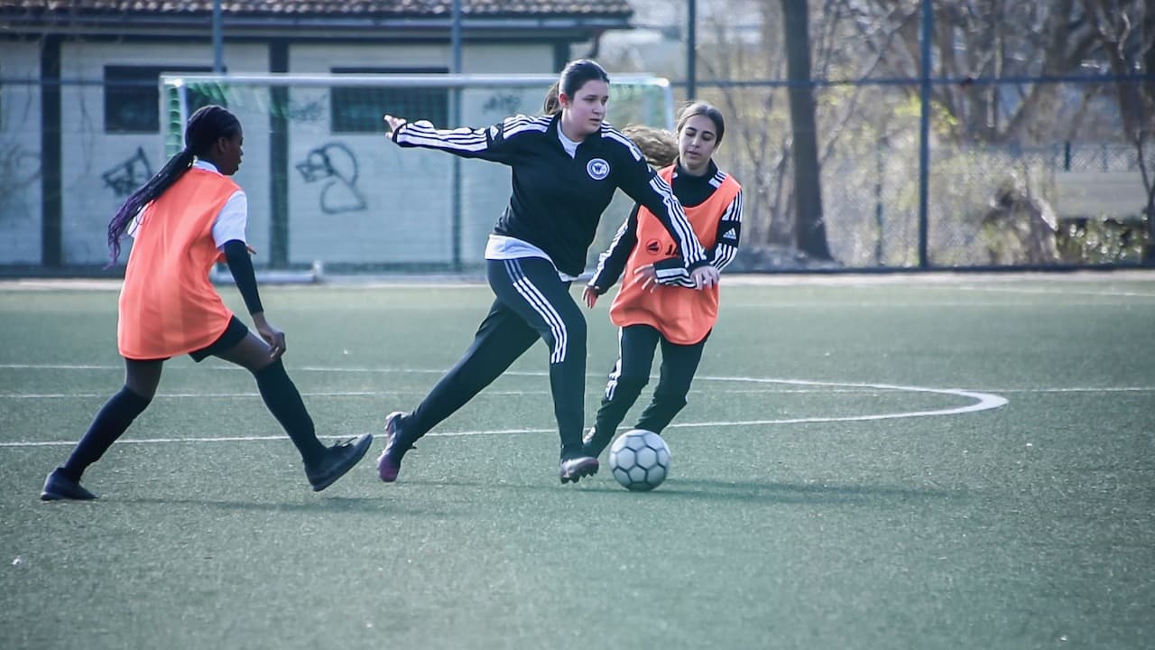 Girls playing football