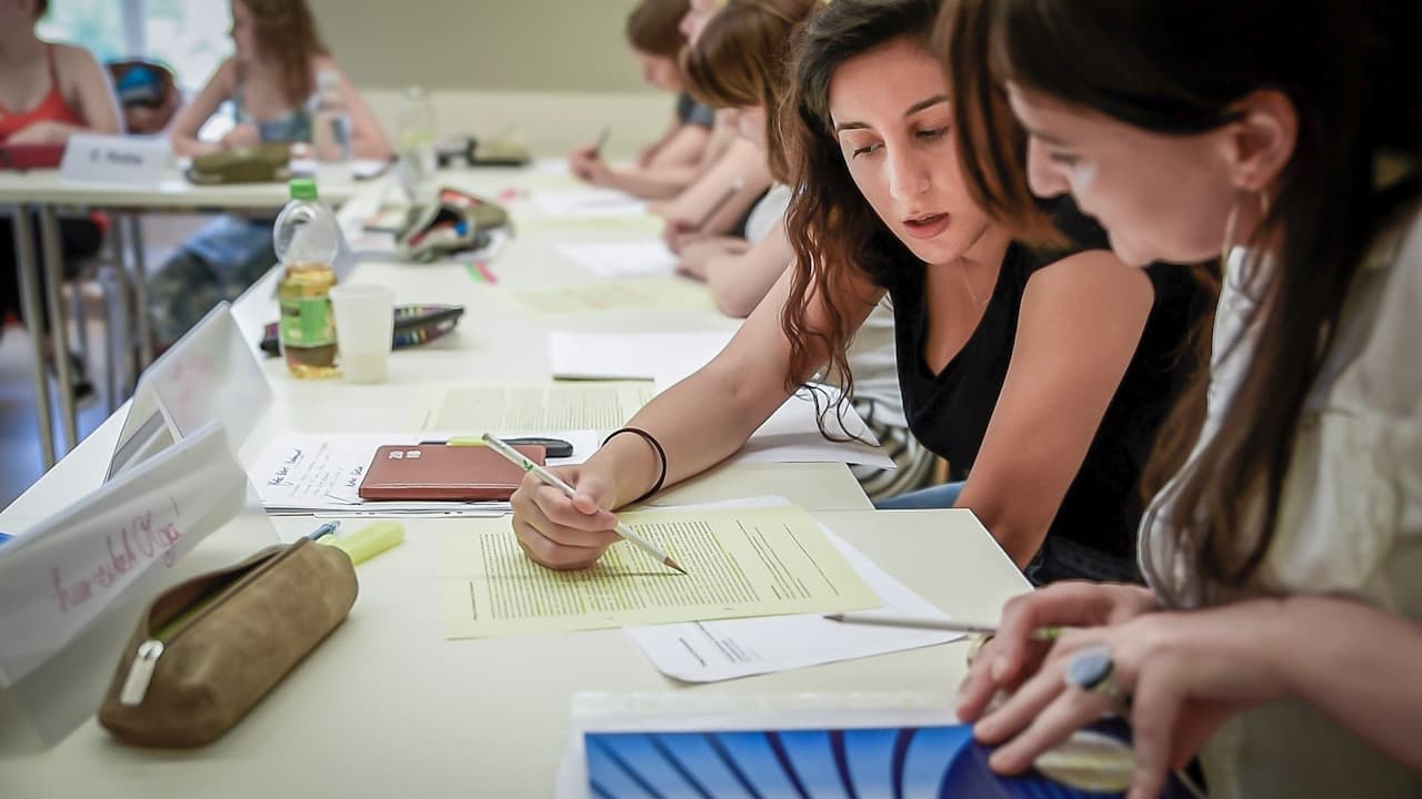 Students discuss assignment in class