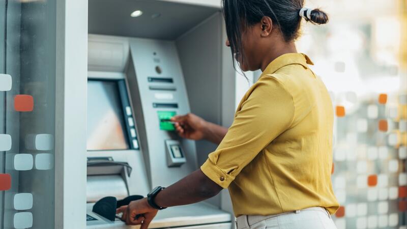 Women using an ATM